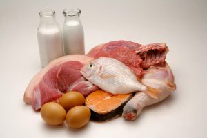 Different kinds of meat, eggs and two bottles of milk --- Image by © Imagemore Co., Ltd./Corbis